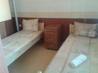 A bed or beds in a room at Osogovo Rooms