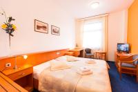 Postel nebo postele na pokoji v ubytování Hotel U Beránka Náchod