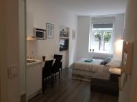 Posteľ alebo postele v izbe v ubytovaní Haustor Apartments