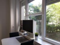 Televízia a/alebo spoločenská miestnosť v ubytovaní Haustor Apartments