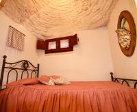 Posteľ alebo postele v izbe v ubytovaní Trulli e Puglia Resort