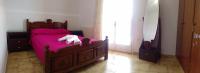 Łóżko lub łóżka w pokoju w obiekcie Fiona Seafront Apartments