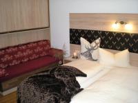 Łóżko lub łóżka w pokoju w obiekcie Hotel Garni Wolfgang