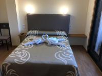 Postel nebo postele na pokoji v ubytování Hostal Santa Baia