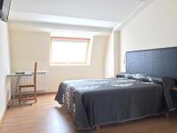 Postel nebo postele na pokoji v ubytování Hostal Santa Baia