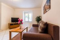 Telewizja i/lub zestaw kina domowego w obiekcie Apartments Gloria