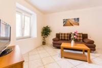 Telewizja i/lub zestaw kina domowego w obiekcie Apartments Gloria