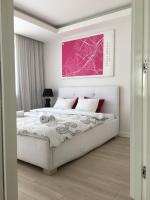 Postel nebo postele na pokoji v ubytování Costa Apartments
