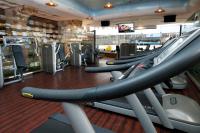 a gym with a row of treadmills at Herods Palace Hotels & Spa Eilat a Premium collection by Fattal Hotels in Eilat
