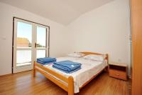 Łóżko lub łóżka w pokoju w obiekcie Apartments Renato