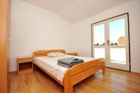 Łóżko lub łóżka w pokoju w obiekcie Apartments Renato