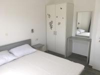 Postel nebo postele na pokoji v ubytování Apartments Suzana