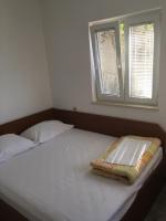 Postel nebo postele na pokoji v ubytování Apartments Suzana