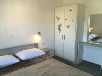 Postel nebo postele na pokoji v ubytování Apartments Suzana
