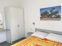 Postel nebo postele na pokoji v ubytování Apartments Suzana