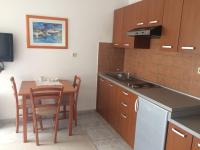 Kuchyň nebo kuchyňský kout v ubytování Apartments Suzana