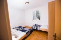 Postel nebo postele na pokoji v ubytování Apartments Adriana