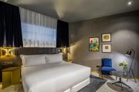 Posteľ alebo postele v izbe v ubytovaní Room Mate Collection Gerard, Barcelona
