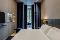 Posteľ alebo postele v izbe v ubytovaní Room Mate Collection Gerard, Barcelona
