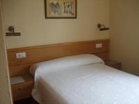 Postel nebo postele na pokoji v ubytování Hotel Los Molinos