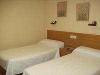 Postel nebo postele na pokoji v ubytování Hotel Los Molinos