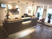 Een TV en/of entertainmentcenter bij Hotel Residence Le Coin
