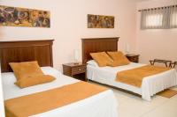 Allamanda Hotelにあるベッド