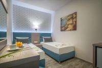 Postel nebo postele na pokoji v ubytování Denise Beach Hotel