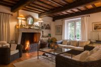 a living room with couches and a fireplace at Saint-Vincent in Saint-Tropez