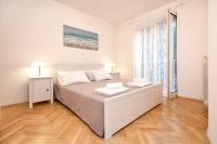 Posteľ alebo postele v izbe v ubytovaní Pine Beach Villa
