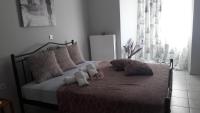 Postel nebo postele na pokoji v ubytování Dimitra Apartments