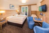 Televízia a/alebo spoločenská miestnosť v ubytovaní Hotel Garni Entstrasser