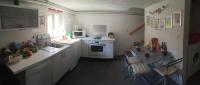 a small kitchen with a sink and a stove at Chez Zabou in Carpentras