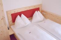 Łóżko lub łóżka w pokoju w obiekcie Pension Hochkönigblick