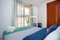 Posteľ alebo postele v izbe v ubytovaní iloftmalaga Puerta del Mar