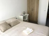 Postel nebo postele na pokoji v ubytování Central Beach Apartment