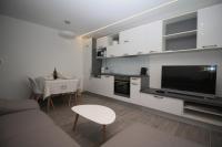 Kuchyň nebo kuchyňský kout v ubytování Central Beach Apartment