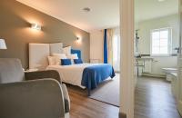 Posteľ alebo postele v izbe v ubytovaní Hotel Boa Vista