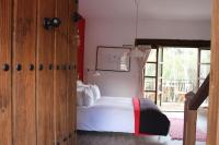 A bed or beds in a room at El Balcón del Huéznar