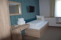 Postel nebo postele na pokoji v ubytování Hotel Rokiten