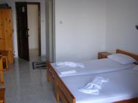 Postel nebo postele na pokoji v ubytování Hotel Tsagarada