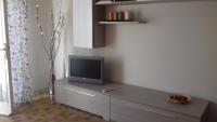 Televízia a/alebo spoločenská miestnosť v ubytovaní Casa Ludovica