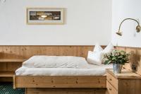 A bed or beds in a room at Hotel Kristall