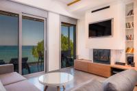 Televízia a/alebo spoločenská miestnosť v ubytovaní Sunrise Rent Rooms
