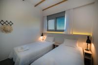 Posteľ alebo postele v izbe v ubytovaní Sunrise Rent Rooms