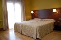 Postel nebo postele na pokoji v ubytování Hotel De Rei