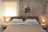 Posteľ alebo postele v izbe v ubytovaní Apartment Tragurium