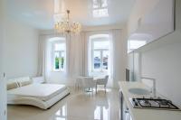 Posteľ alebo postele v izbe v ubytovaní Collins Apartments Center