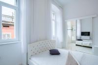 Posteľ alebo postele v izbe v ubytovaní Collins Apartments Center
