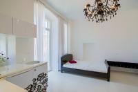 Posteľ alebo postele v izbe v ubytovaní Collins Apartments Center
